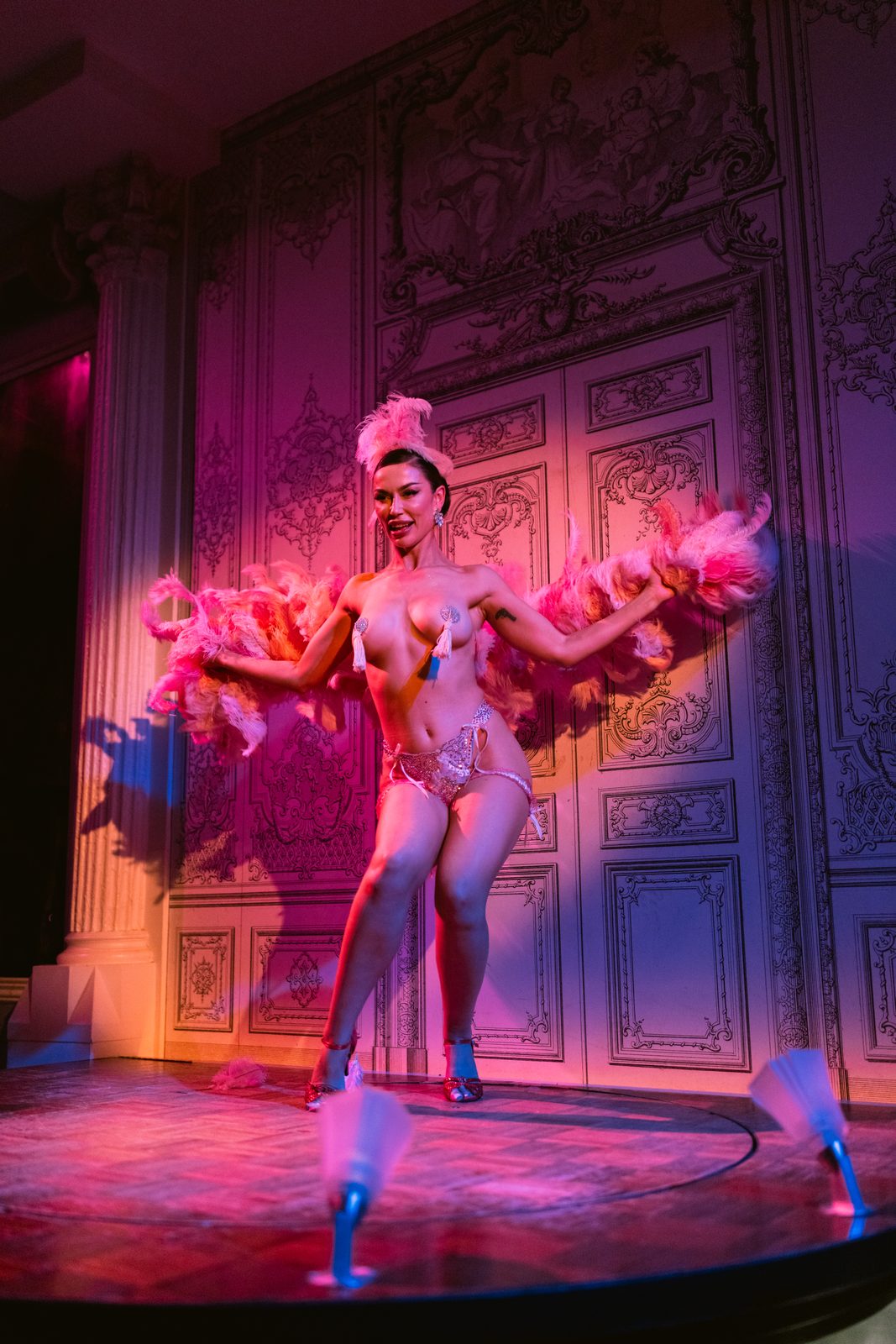 Classic burlesque pose on an ornate theater stage