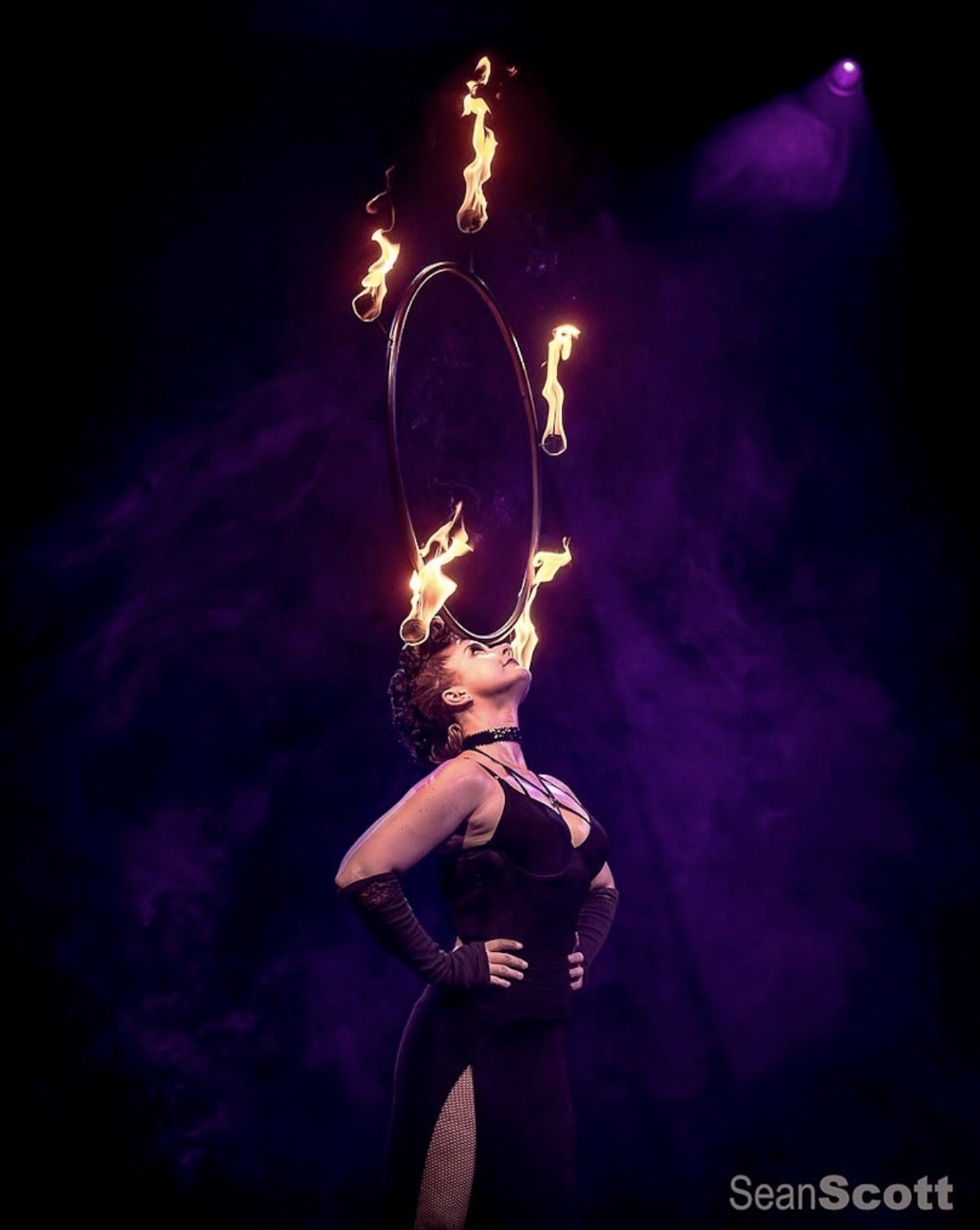 Fire ring held overhead during a nightclub performance