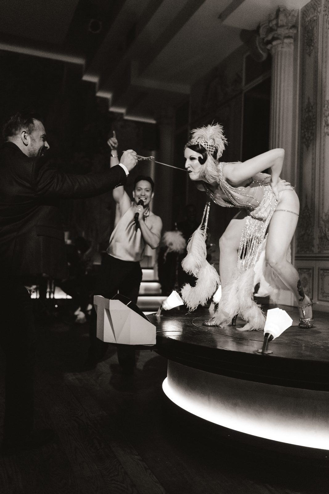 Dramatic black-and-white portrait of a sword swallowing act
